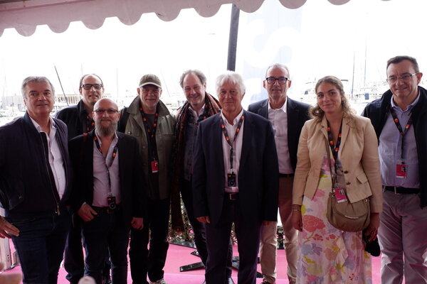 L'équipe Transpacam à Cannes 2023 : De g. à dr. : Olivier Duval, Serge Thurot, Serge Hoarau, Pascal Becu, Yannick Bétis, Didier Diaz, Alain Rocca, Sarah Talpaert, Franck Graumann. - Photo : Jean-Noël Ferragut