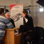 Mickael Rousseau, de dos, Gilles Rousseau et Lucie Wibault (Transpamedia) sur le stand Lumex - Photo Pauline Maillet © AFC 