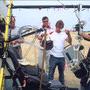 Tournage en IMAX pour "Voyageurs du ciel et de la mer" - De g. à d. : le pilote du paramoteur, MIchel Benjamin, Felipe Texeira et (…) 