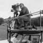 Bernard Château at the camera, on a Citroën DS roof (undated) - Bernard Château Collection 