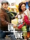 Un + une