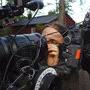 Catherine Georges, cleaning the lens 