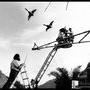 Shooting the “duck fair” scene on a crane with a crew member - Nikos Meletopoulos, left, Patrick Grandperret, operating, and a crew member - (...) 