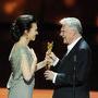 Michael Ballhaus receives the "Deutscher film" prize from Iris Berben's hands in 2012 