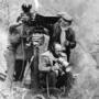 On location of "Buffet froid" by Bertrand Blier (seated). Jean Penzer is standing behind him - Jean Penzer Archives 