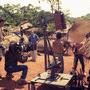 Tournage au pentographe, dans un décor de village en Côte d'Ivoire, sur "L'Enfant lion" - De g. à d. : Olivia Bruynoghe, (...) 