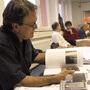 Armand Marco looking at Imago's book layout during a meeting in Vienna in 2003 - Photo Marc Salomon 