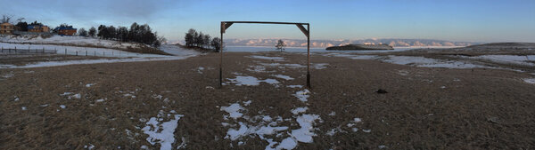 Baikal Stadium - My thoughts go out to my friend Bernard Chambaz who would have liked to shoot a ball on this football field on Lake Baikal. We can appreciate the designers who forgot to plan for a goalie on the other side… <i>(Gilles Porte, Sunday 8 March)</i>