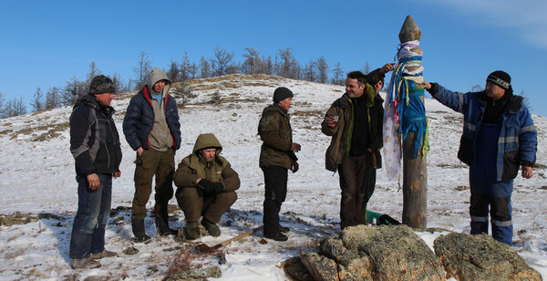 Cyril and his crew of Siberians - Cyril toasts with the people who helped him erect his totem pole… In a few hours, the actors will be doing the same as part of the script. <i>(Photo by Irina Semibratova, art department crew, Thursday 12 February)</i>