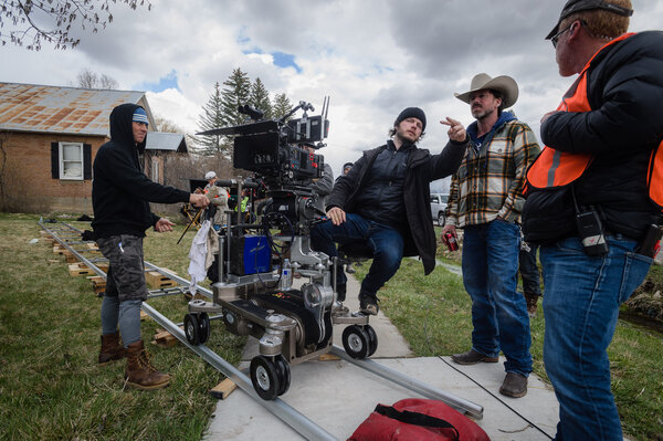 Ben Richardson and Taylor Sheridan surrounded by their team