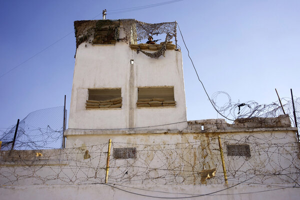 Majd in his watchtower - Zarqa: Majd, the Palestinian 4<sup class="typo_exposants">th</sup> assistant director, spends three hours as an extra in his watchtower dressed in a Israel Defense Forces uniform. He will always be out of the frame, and so there won't be any call sheet this evening. <i>(Samuel, July Monday 7)</i>