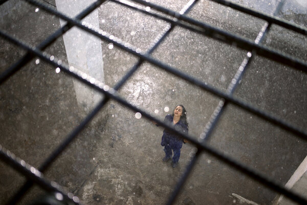 Maïssa in Zarqa - Zarqa, “retake” day. We're redoing the rain scene in the prison yard. Maïssa looks like she's holding up the metal mesh in this photo. But in reality, it was she who bore this film on her back for the last 6 weeks… <i>(Samuel, July Saturday 26)</i>