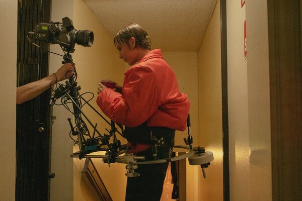 During the take, Shane Ainsworth's hand sets the camera around the singer.