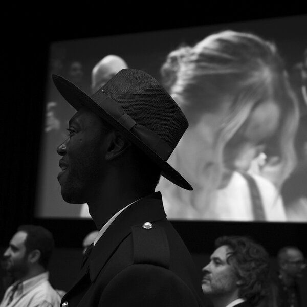 Auditorium "Lumière" - Wednesday, May 15 - 5:43pm | Picture Gilles Porte, AFC - Baloji (co-president of the Caméra d'or) looking for the "Diamant Brut" team when the Lumière room lights up again at the end of the screening and director Agathe Riedinger appears on the huge screen...